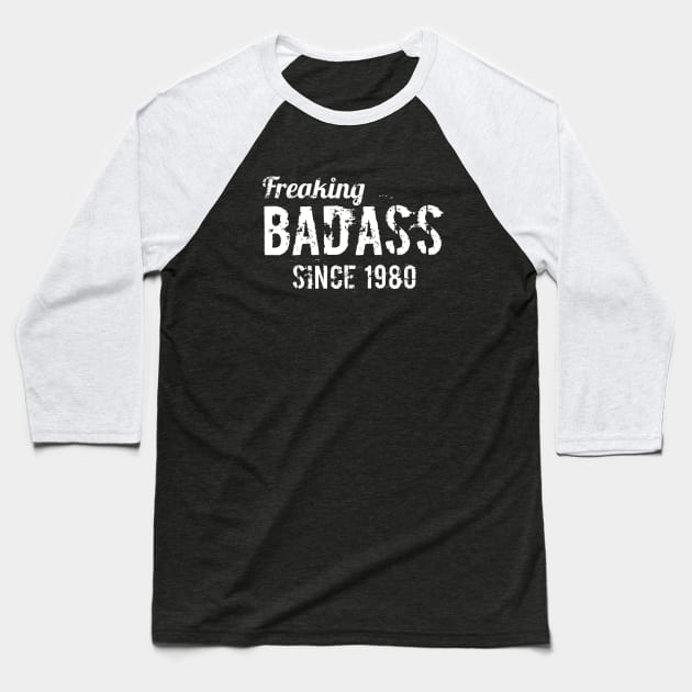 Freaking badass since 1980 Baseball T-Shirt by hoopoe